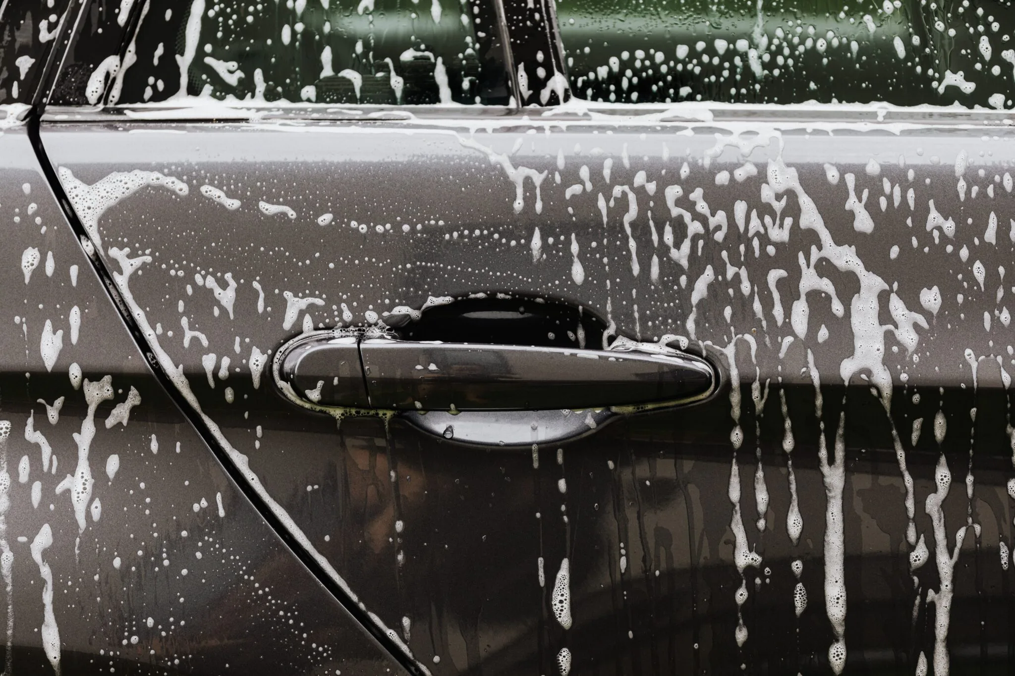 Foam exterior close-up during vehicle detailing