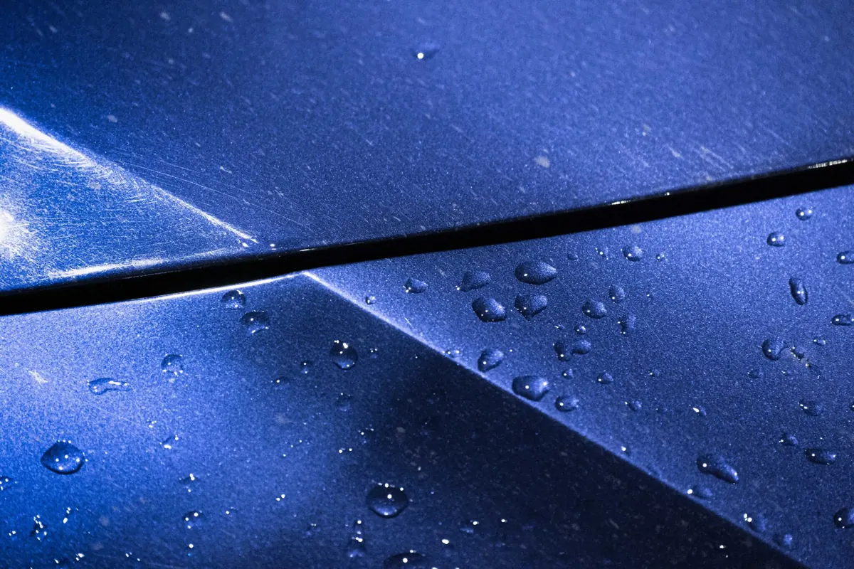 Swirl marks and paint defects visible on vehicle paint